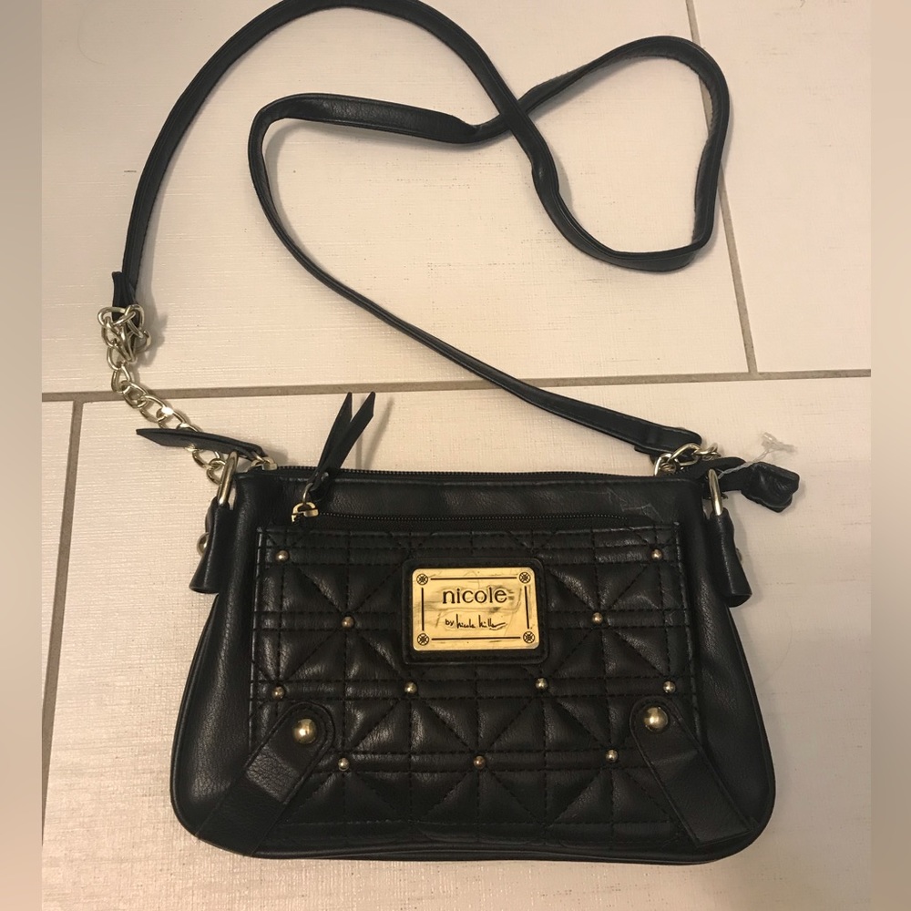 Nicole by Nicole miller black crossbody bag. Gorgeous magenta interior.